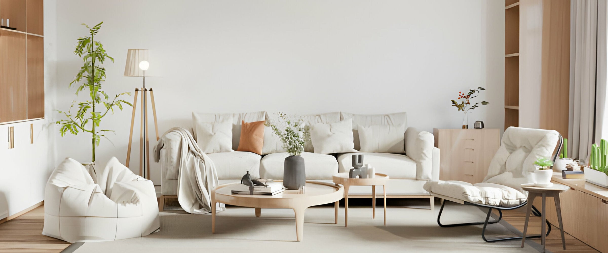 Modern living room with white sofa, coffee table, and decorative items.